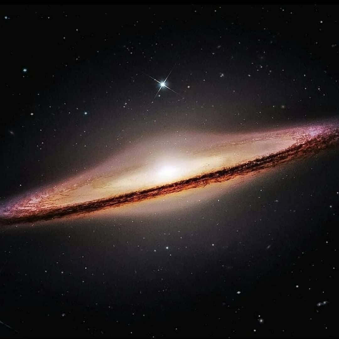 Stunning Image Of The Sombrero Galaxy In The Night Sky Wallpaper