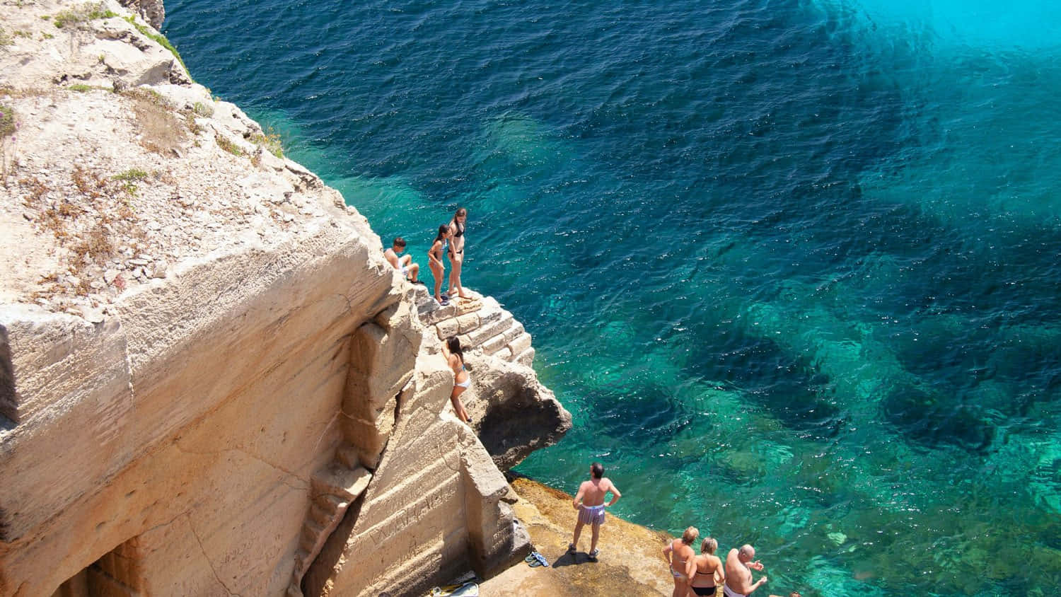 Stunning Italian Island With Crystal-clear Waters, Sandy Beach, And Vibrant Landscape Wallpaper