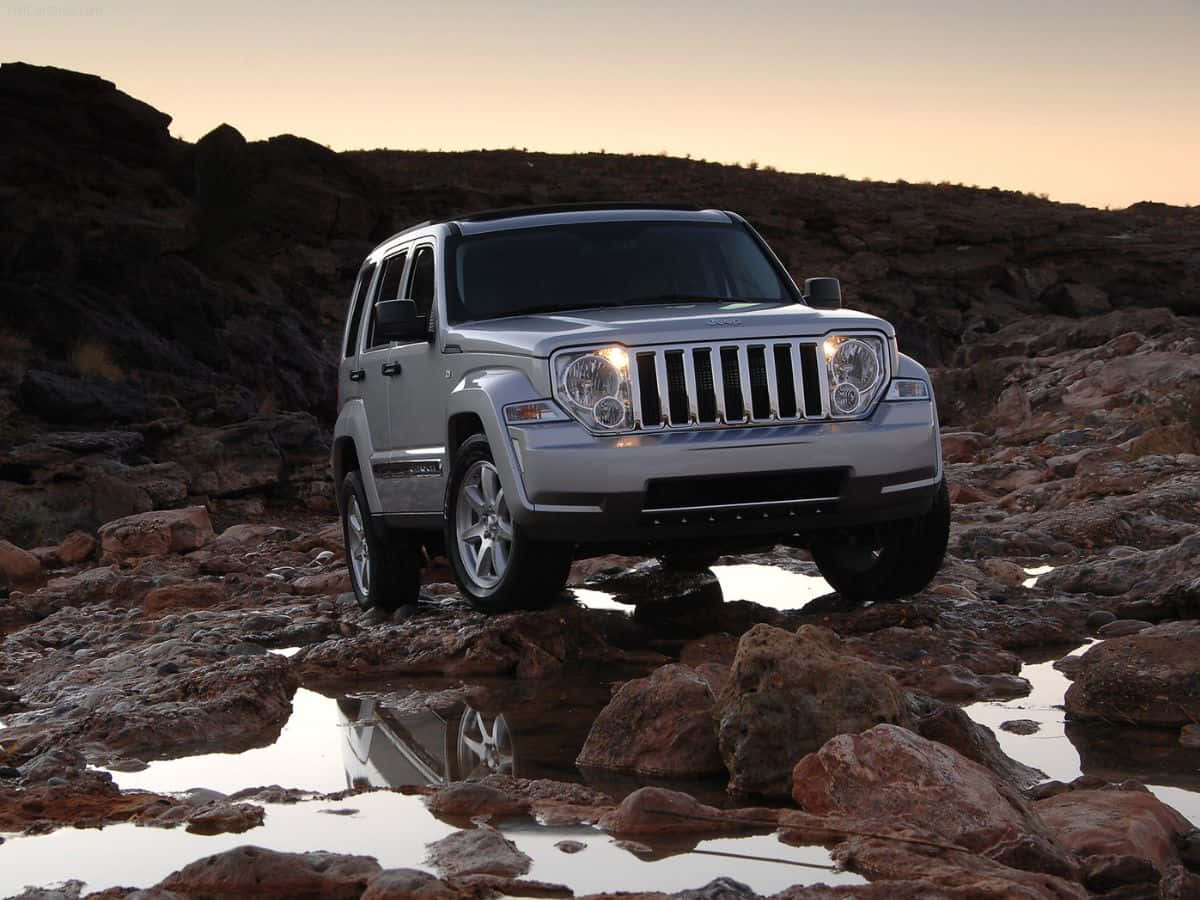 Stunning Jeep Liberty In Wilderness Wallpaper