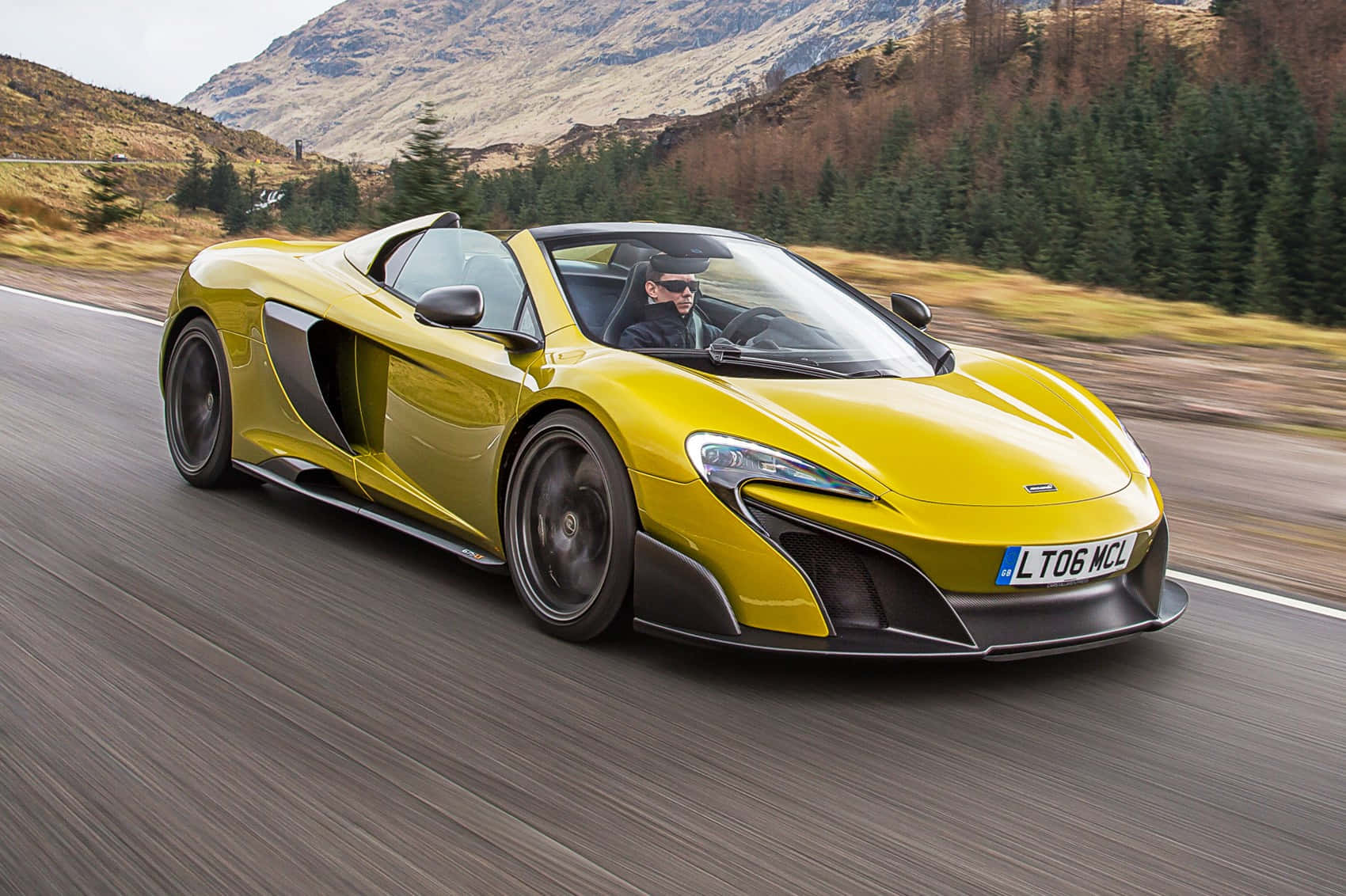 Stunning Mclaren 675lt Spider On The Open Road Wallpaper