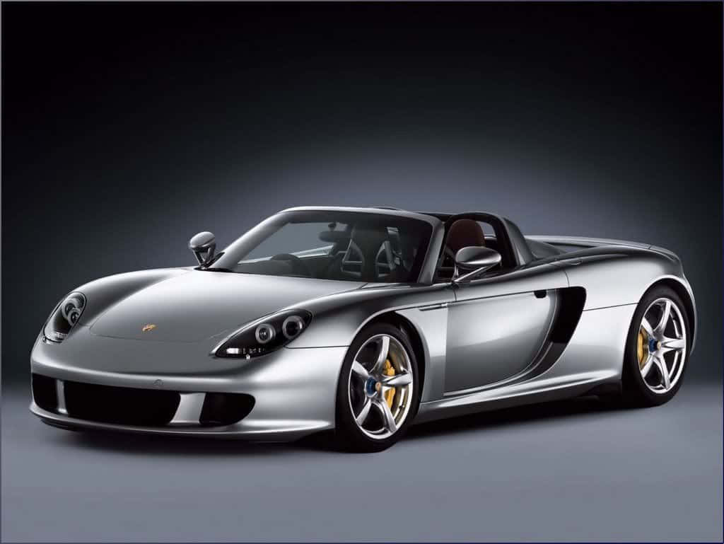 Stunning Porsche Carrera Gt Gliding On The Open Road Wallpaper