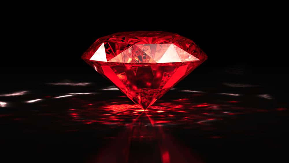 Stunning Red Diamond On Reflective Surface Wallpaper