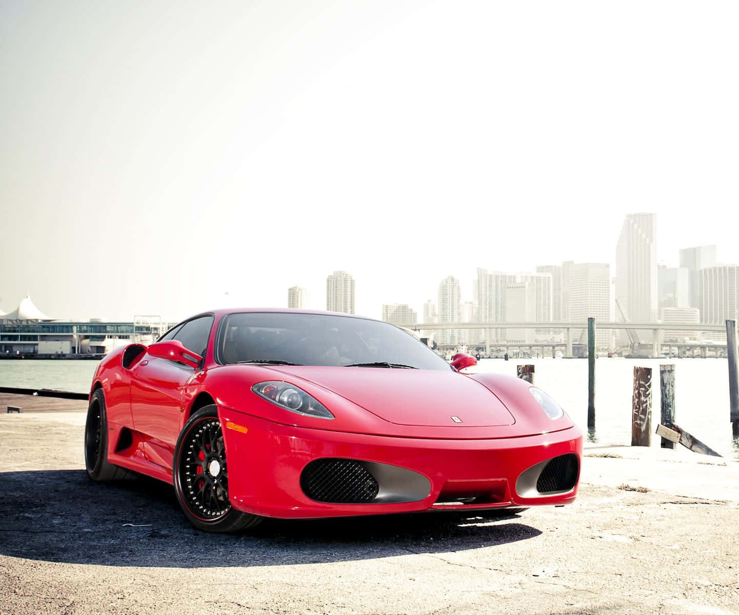 Stunning Red Ferrari 360 Modena Parked On A Picturesque Location Wallpaper