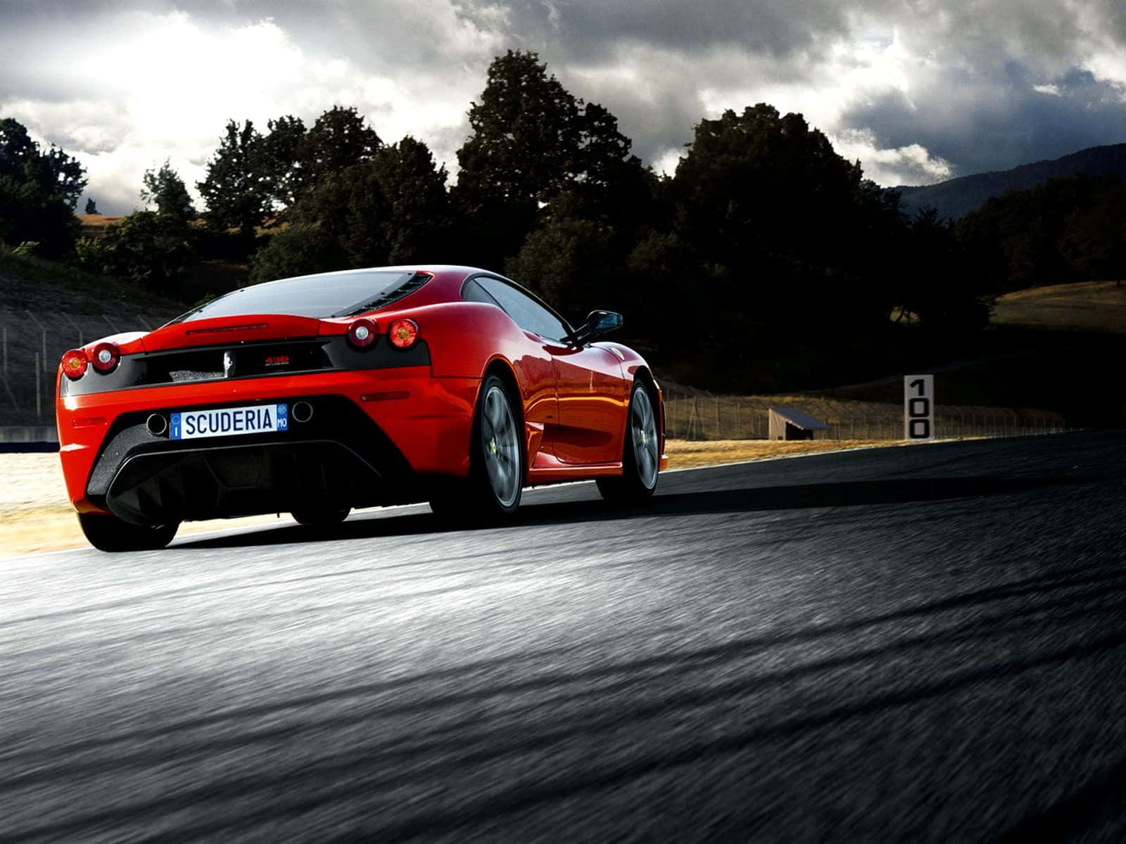 Stunning Red Ferrari F430 Captured In Motion Wallpaper