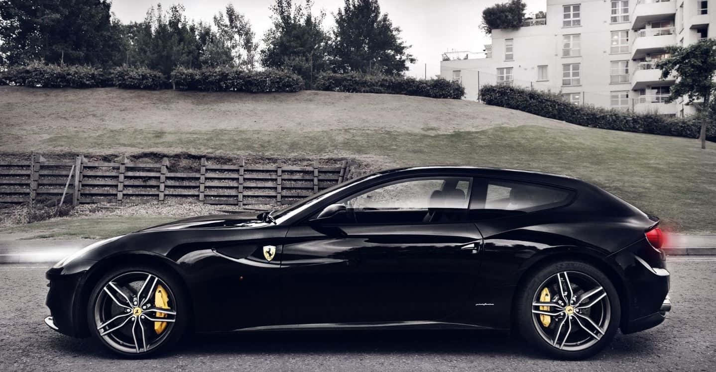 Stunning Red Ferrari Ff On Open Road Wallpaper