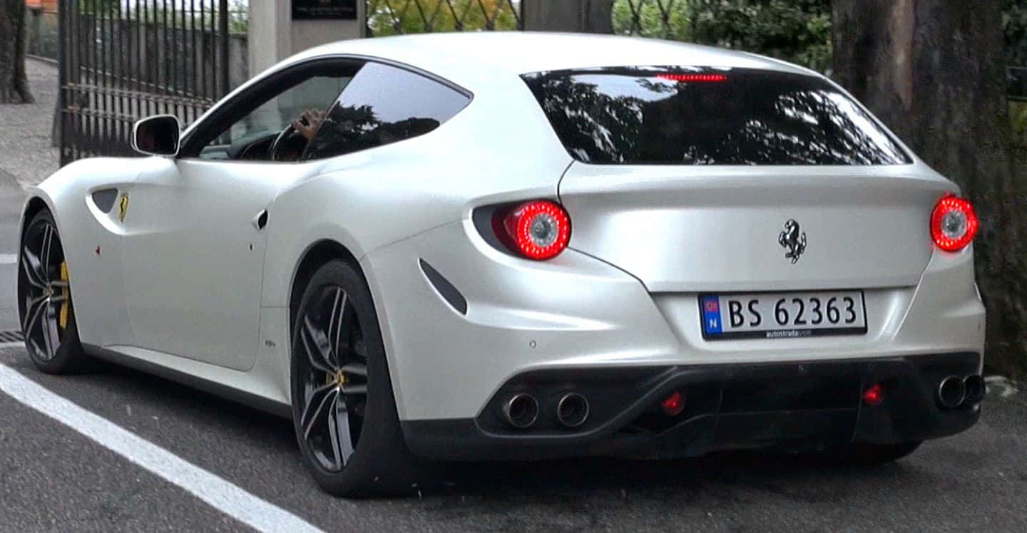 Stunning Red Ferrari Ff On The Road Wallpaper