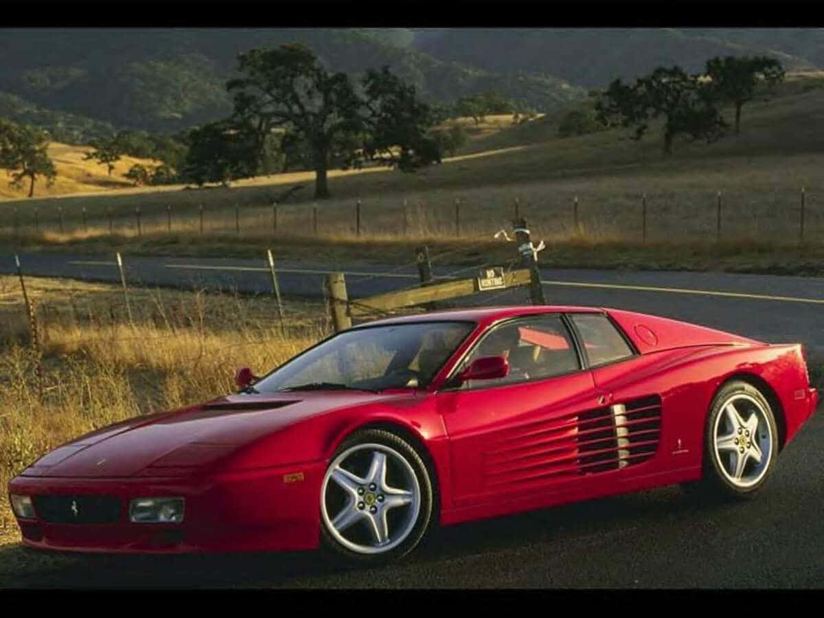 Stunning Red Ferrari Testarossa In Its Prime Wallpaper