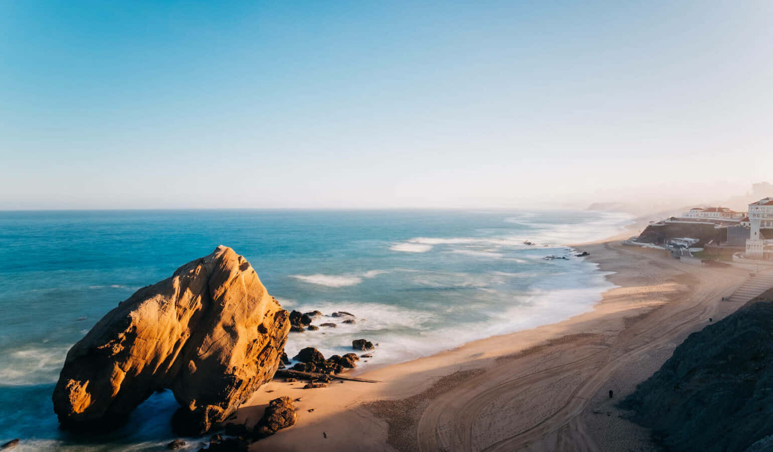 Stunning Sunset At The Picturesque Portuguese Beach Wallpaper