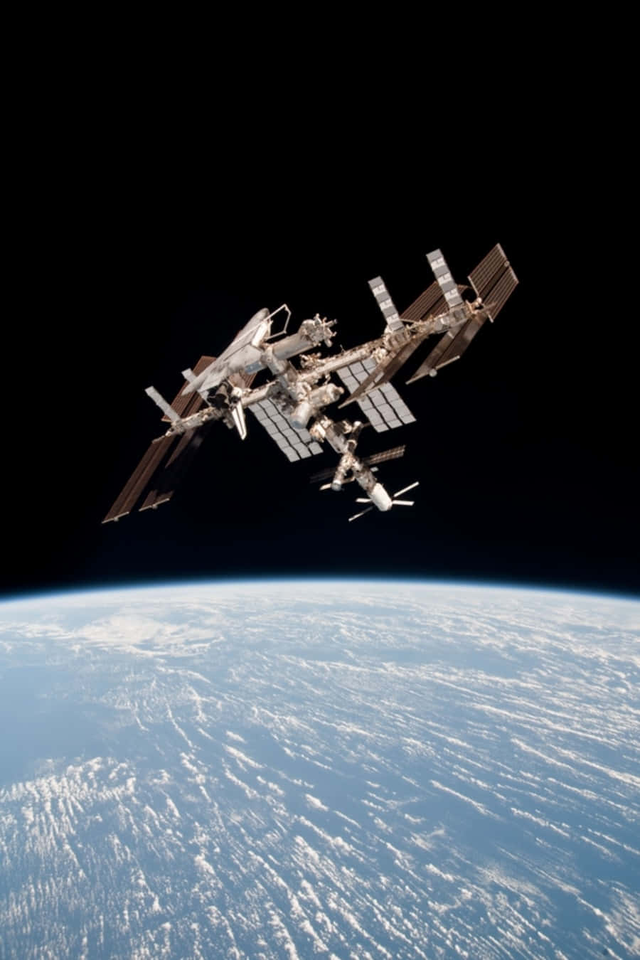 Stunning View Of The International Space Station (iss) In Earth's Orbit Wallpaper