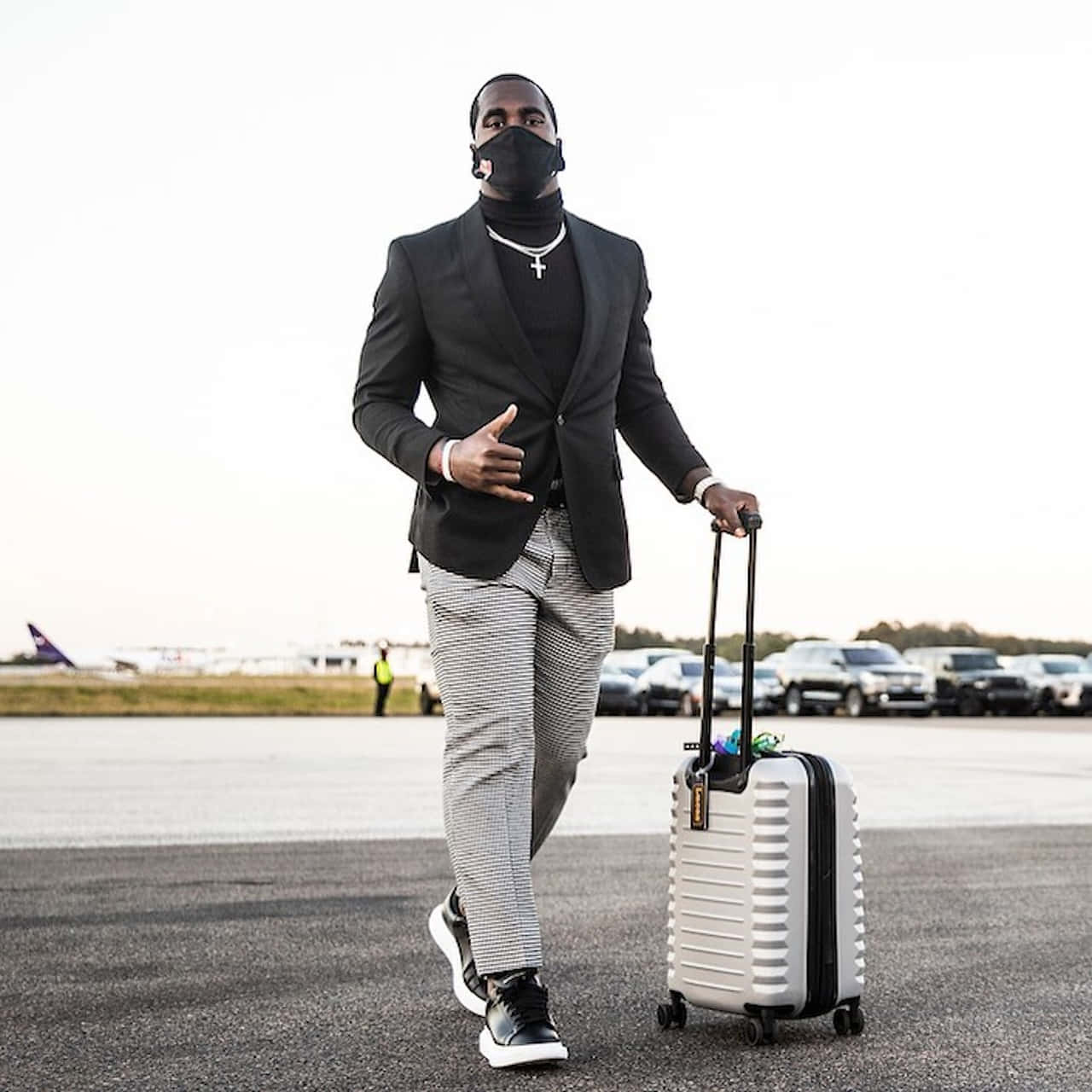 Stylish Athlete Arrivalat Airport Wallpaper