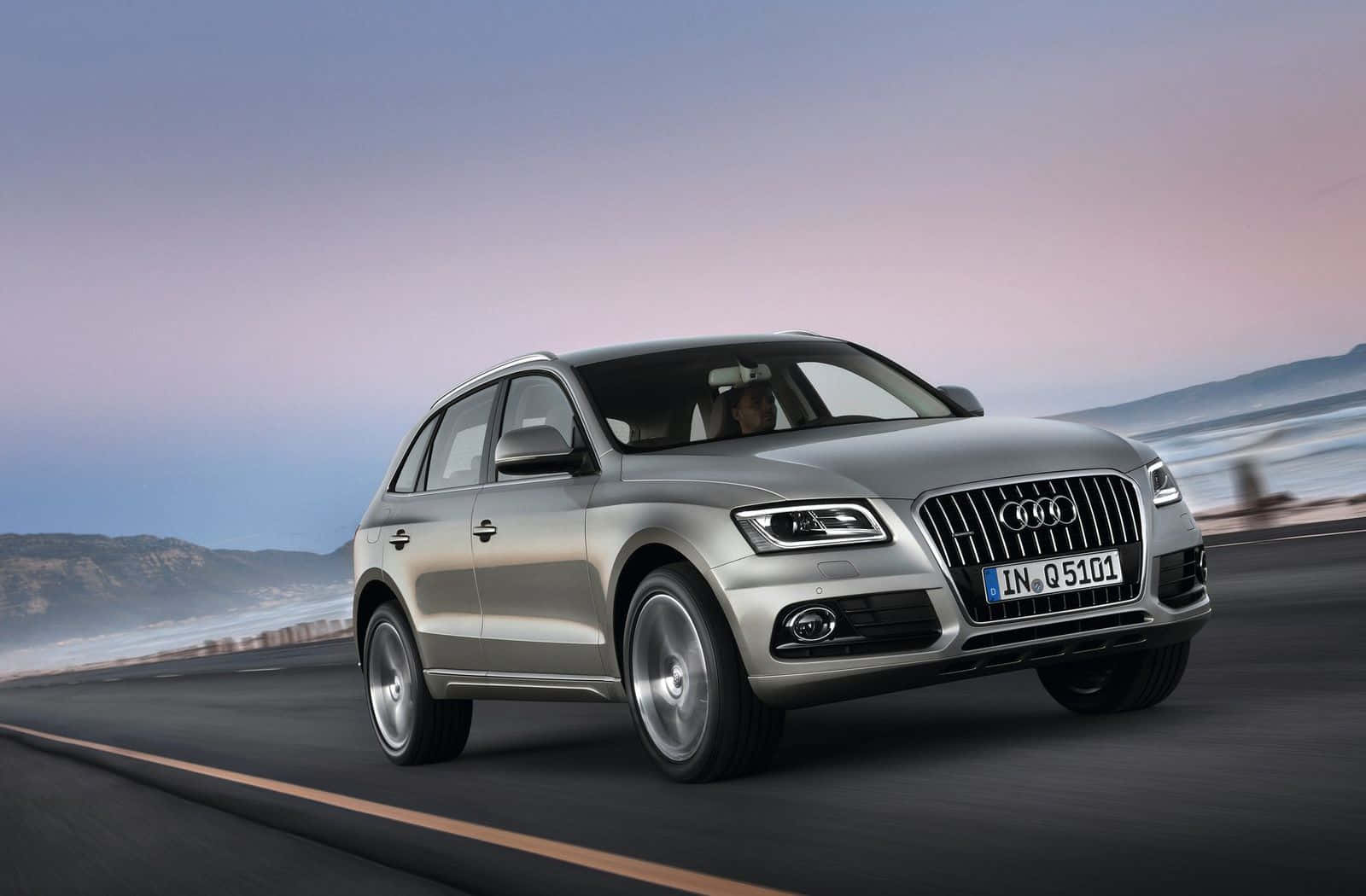 Stylish Audi Q5 In A Picturesque Landscape Wallpaper