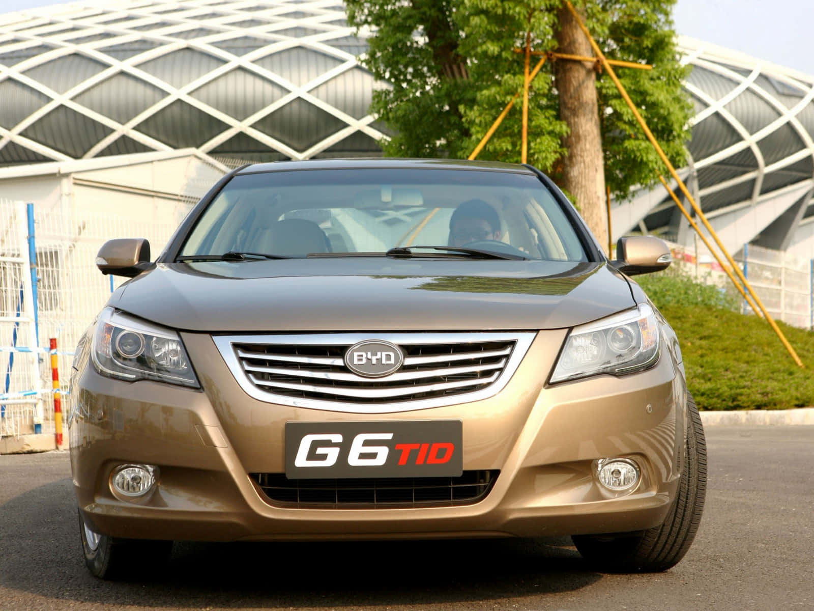 Stylish Byd Electric Vehicle On The Road Wallpaper