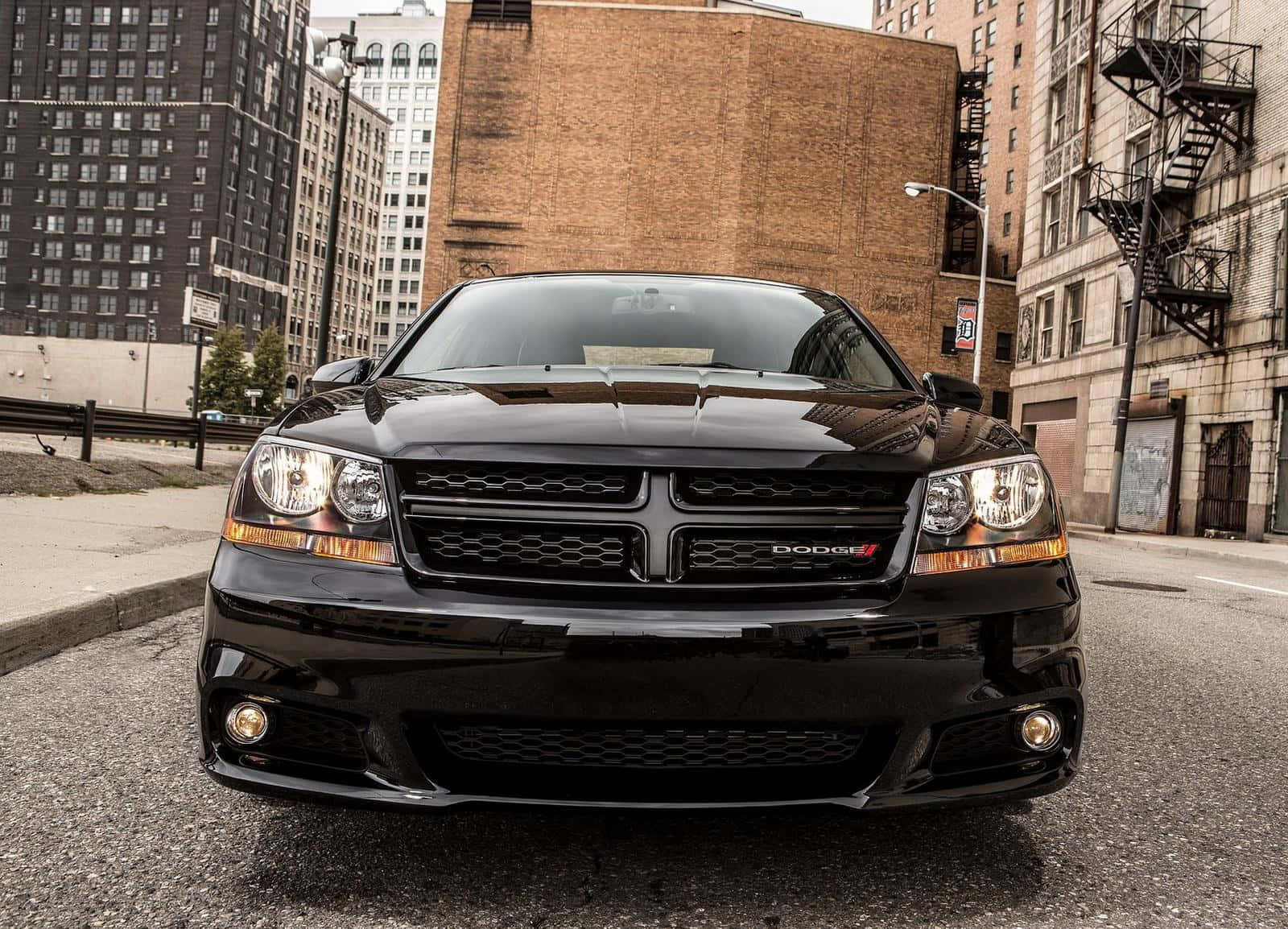 Stylish Dodge Avenger On The Open Road Wallpaper