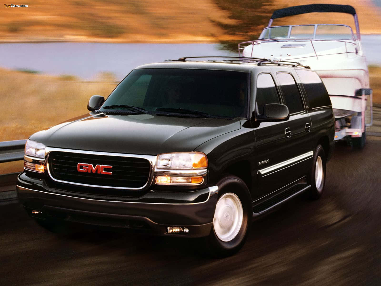 Stylish Gmc Yukon On The Road Wallpaper