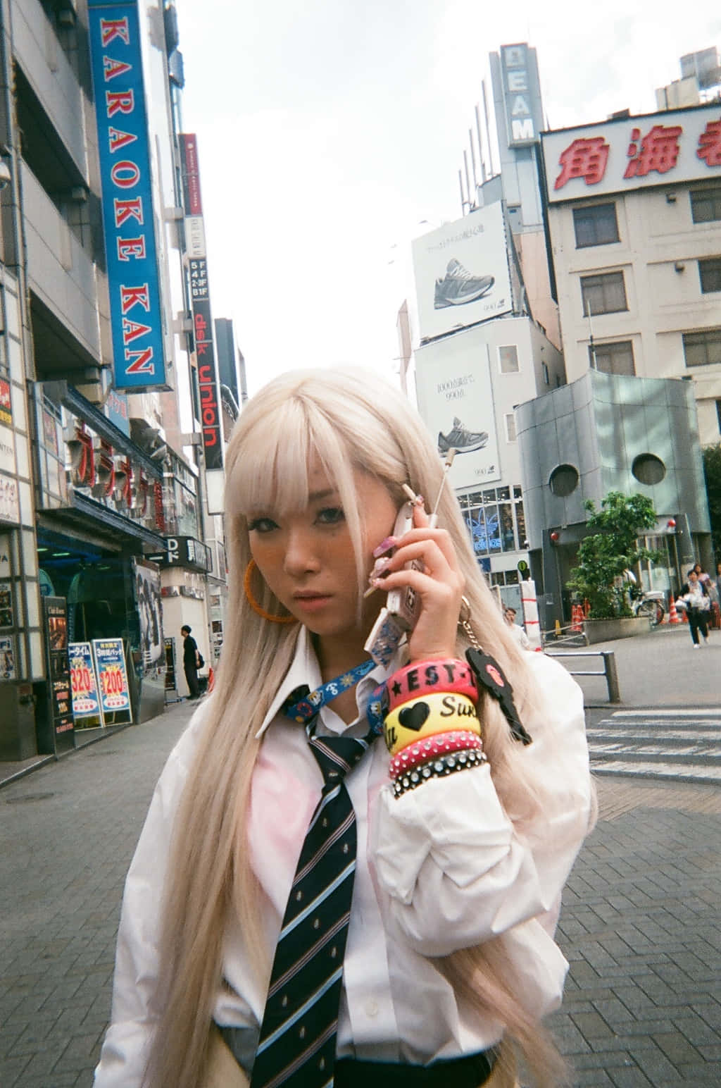 Stylish Gyaru Fashion Outfit In Urban Setting Wallpaper