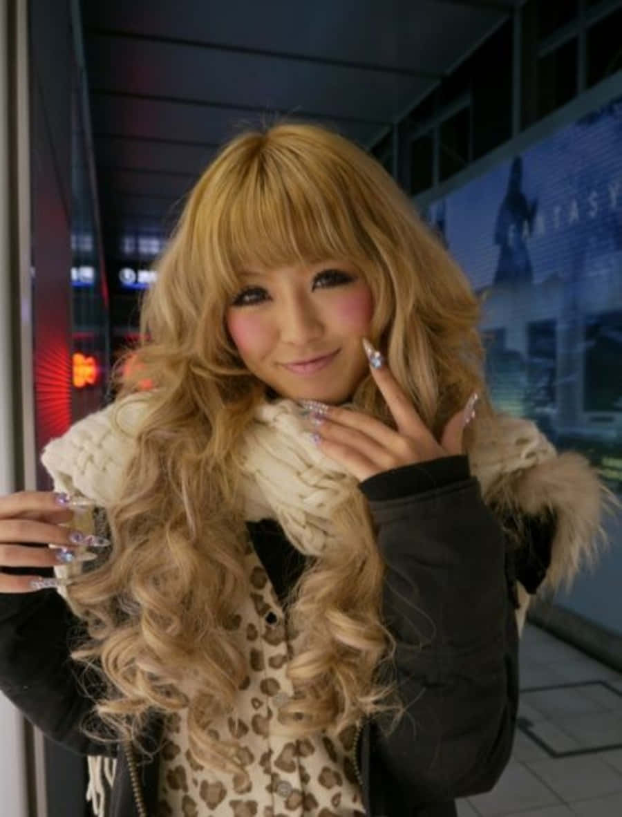 Stylish Gyaru Girl Posing Outdoors Wallpaper