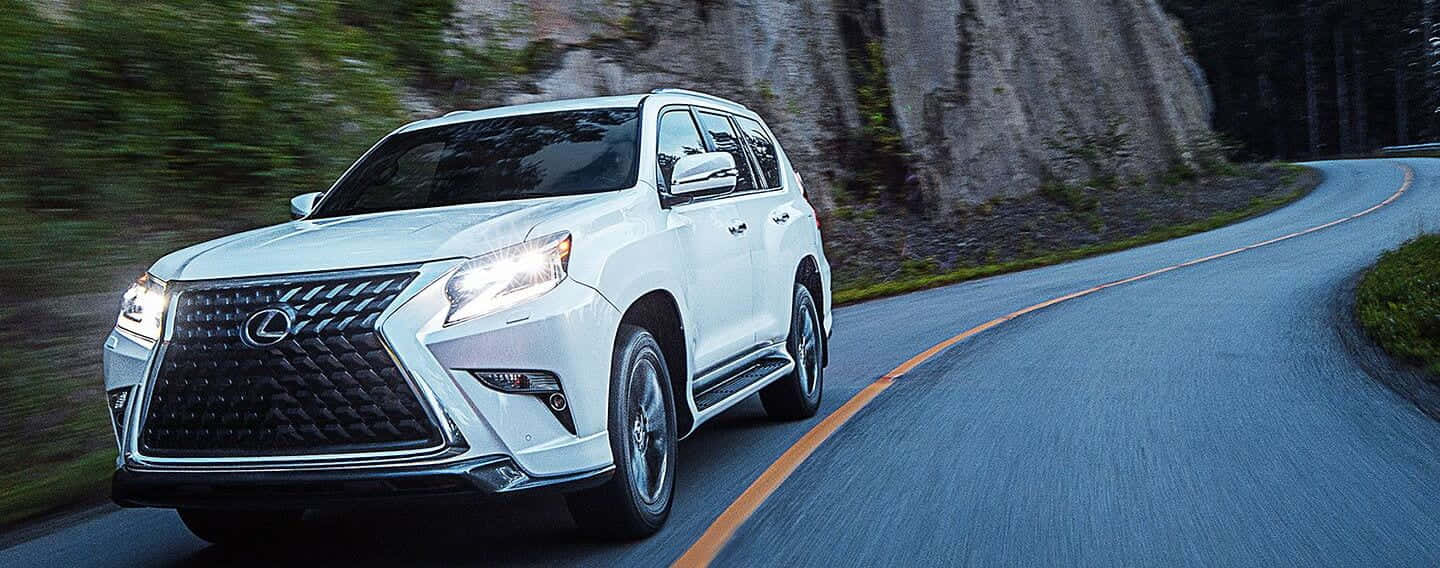 Stylish Lexus Gx 460 Suv On A Scenic Road Wallpaper