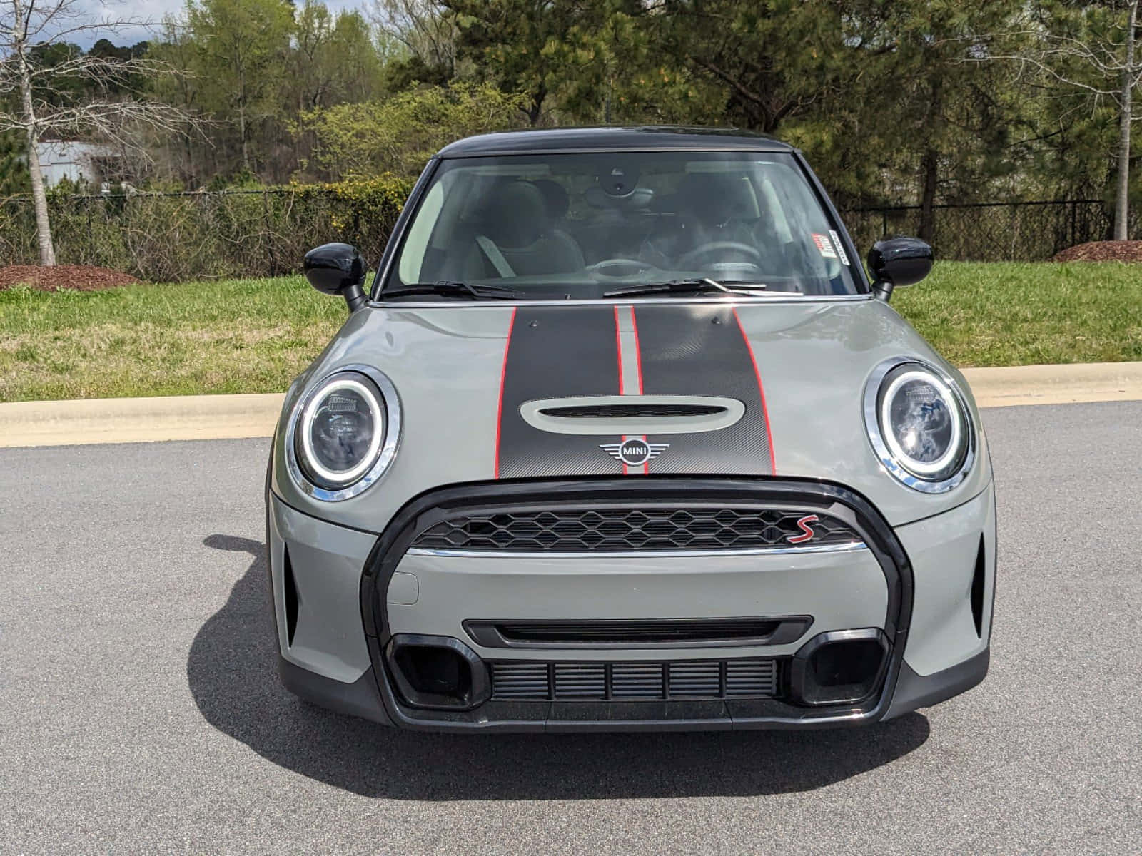 Stylish Mini Cooper Hardtop 2 Door Showcasing Its Sleek Design On The Open Road. Wallpaper