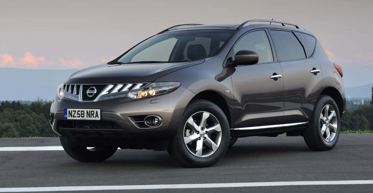 Stylish Nissan Murano Cruising On The Road Wallpaper