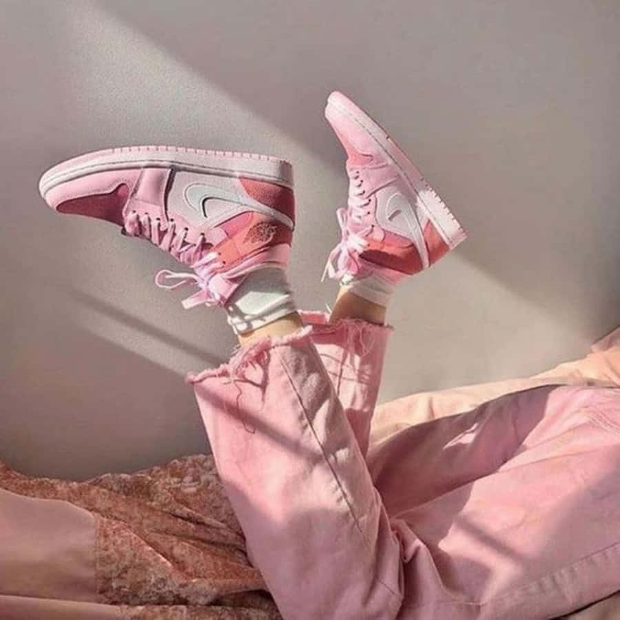 Stylish Pink Shoes On A White Surface Wallpaper