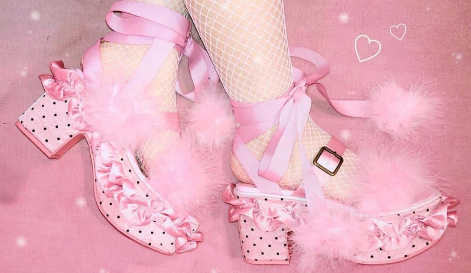 Stylish Pink Shoes On A Wooden Floor Wallpaper