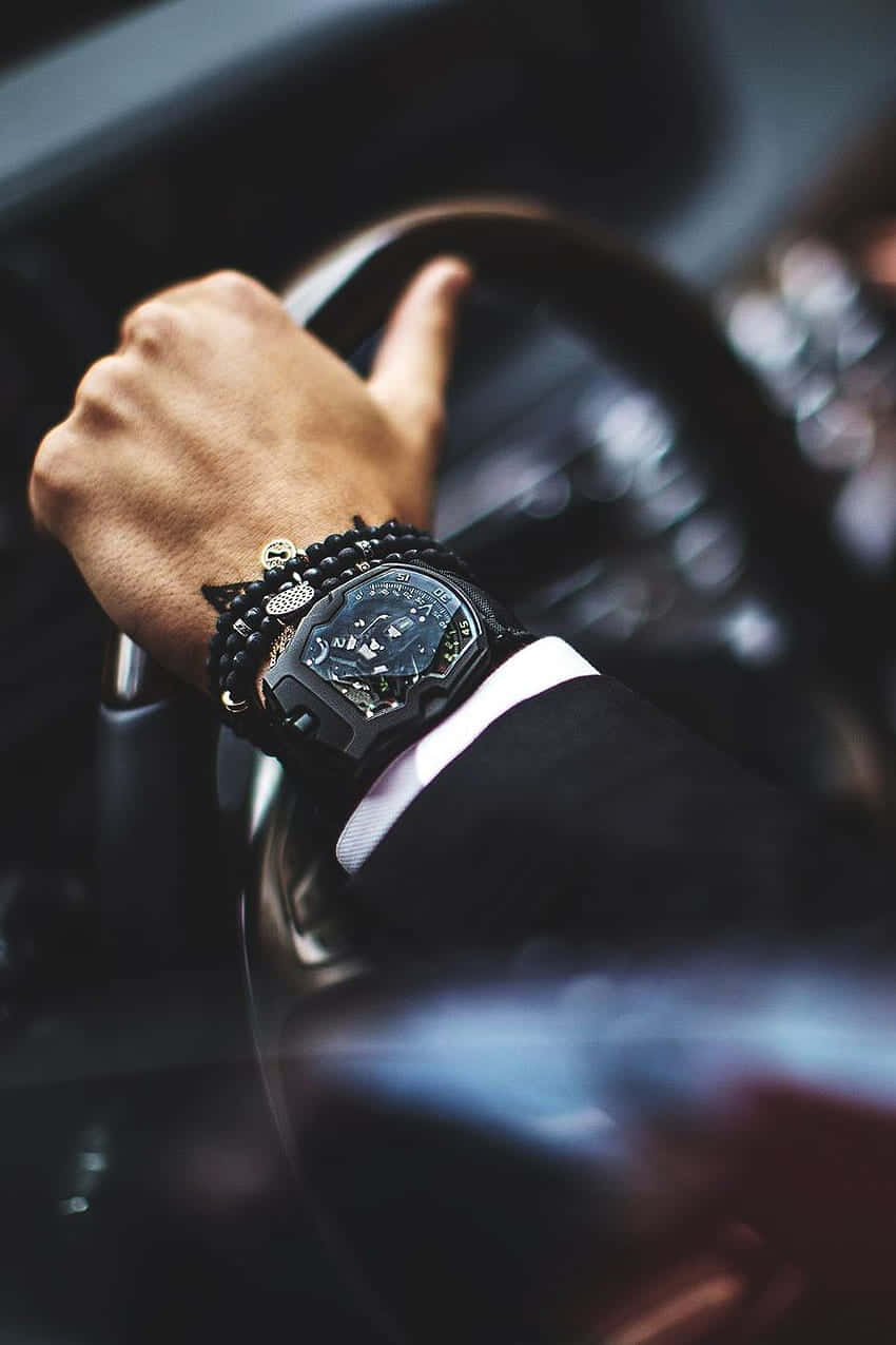 Stylish Wristwatchand Bracelet While Driving Wallpaper