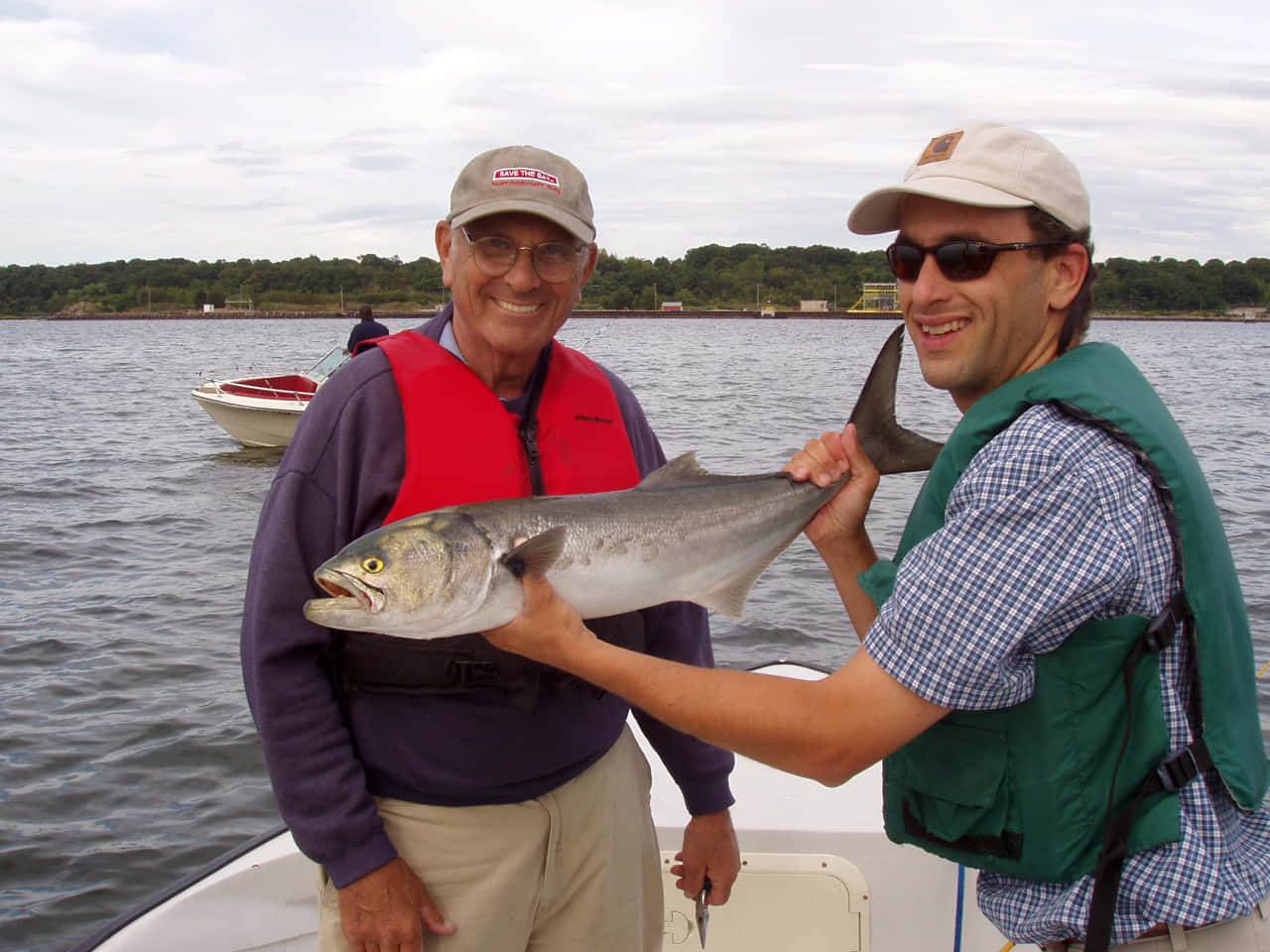 Successful Bluefish Catch Two Men Boat Wallpaper