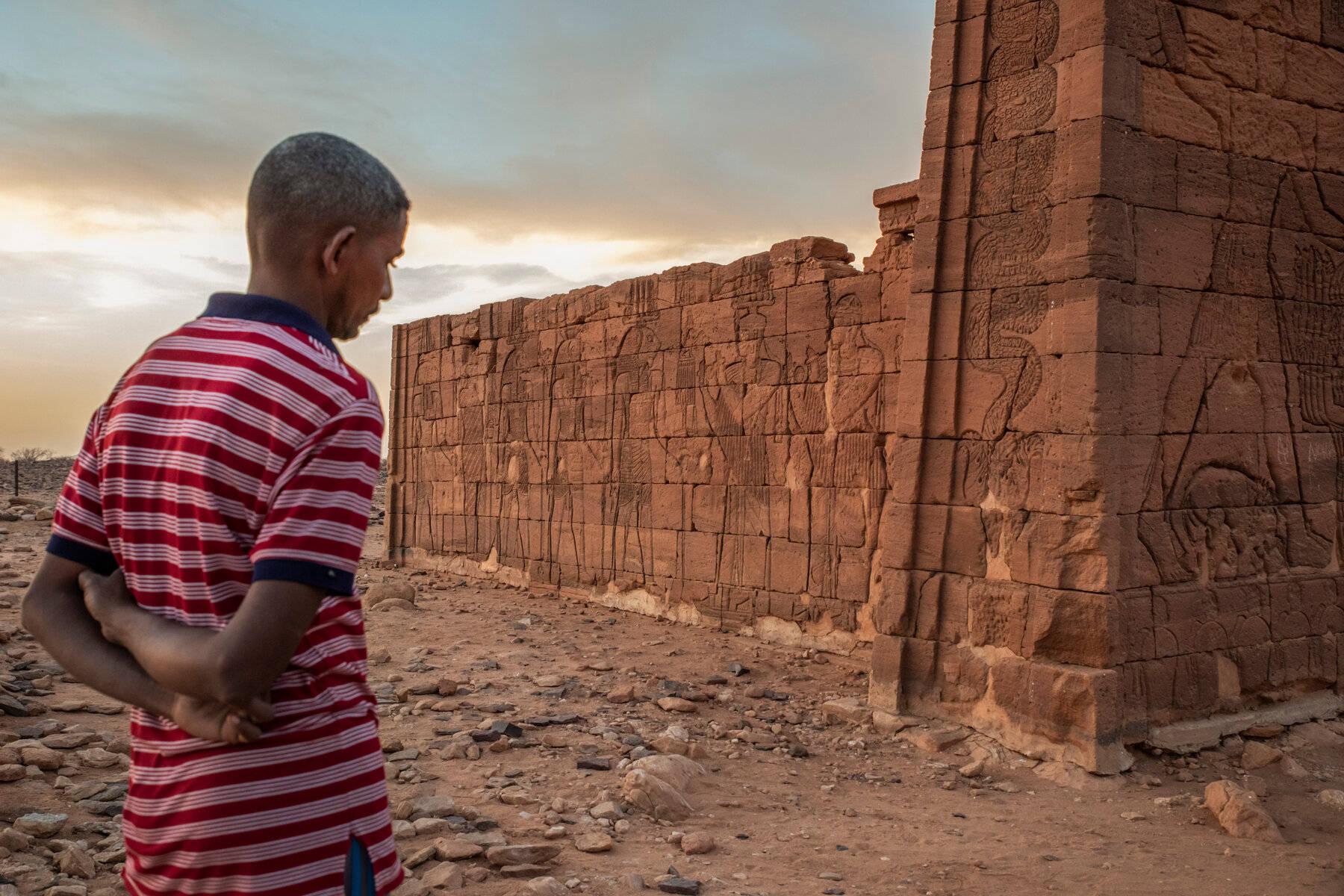 Sudanese Man At Ancient Hieroglyphics Wallpaper