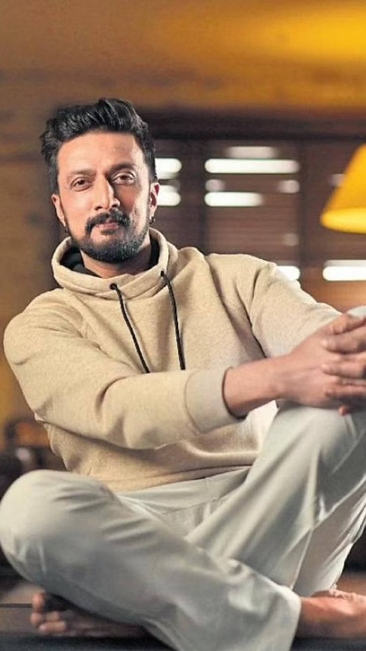 Sudeep Sitting Casually Wallpaper