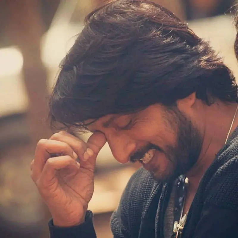 Sudeep Smiling By Himself Wallpaper