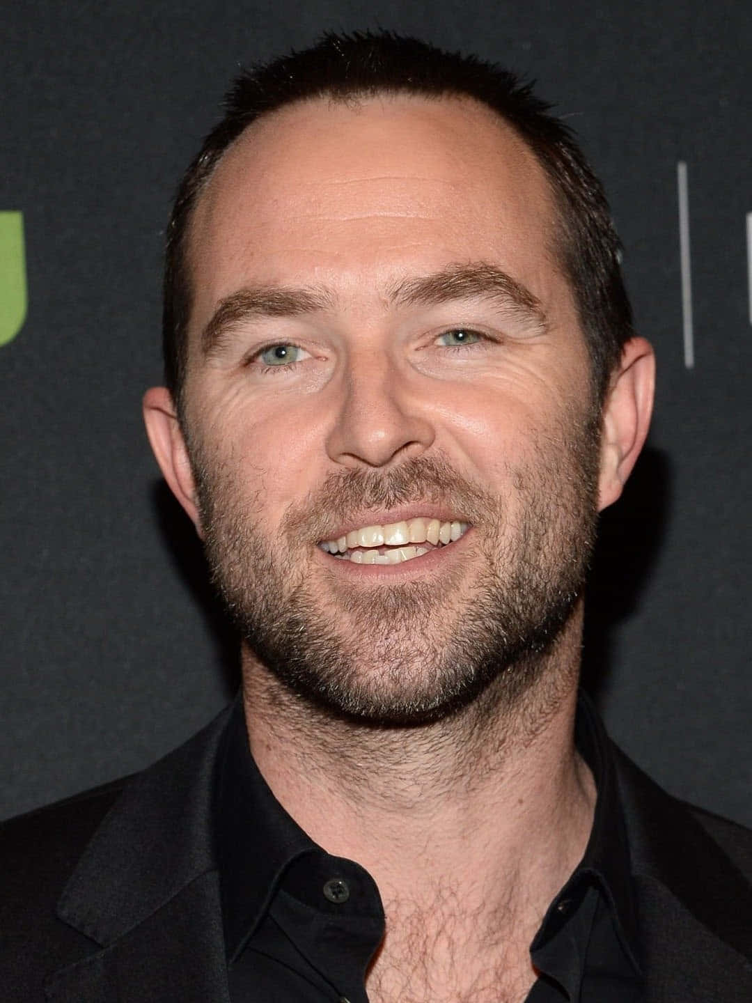 Sullivan Stapleton Smiling Portrait Wallpaper