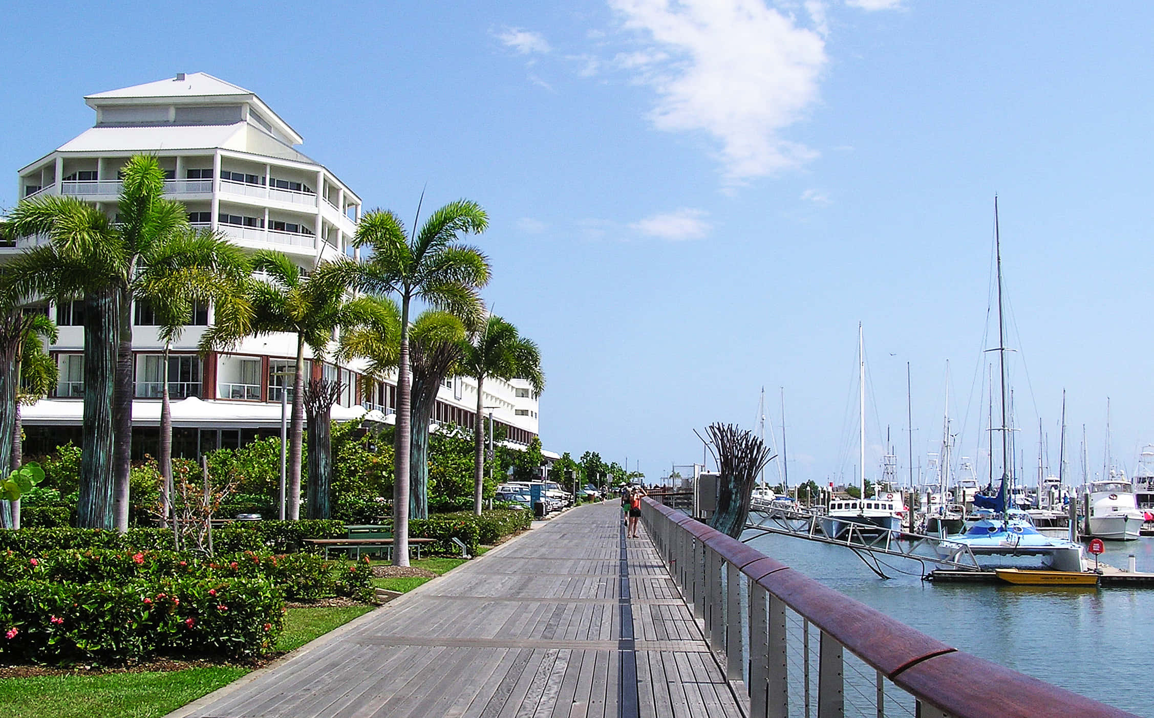 Sun-drenched Cairns Beach At Early Morning Wallpaper