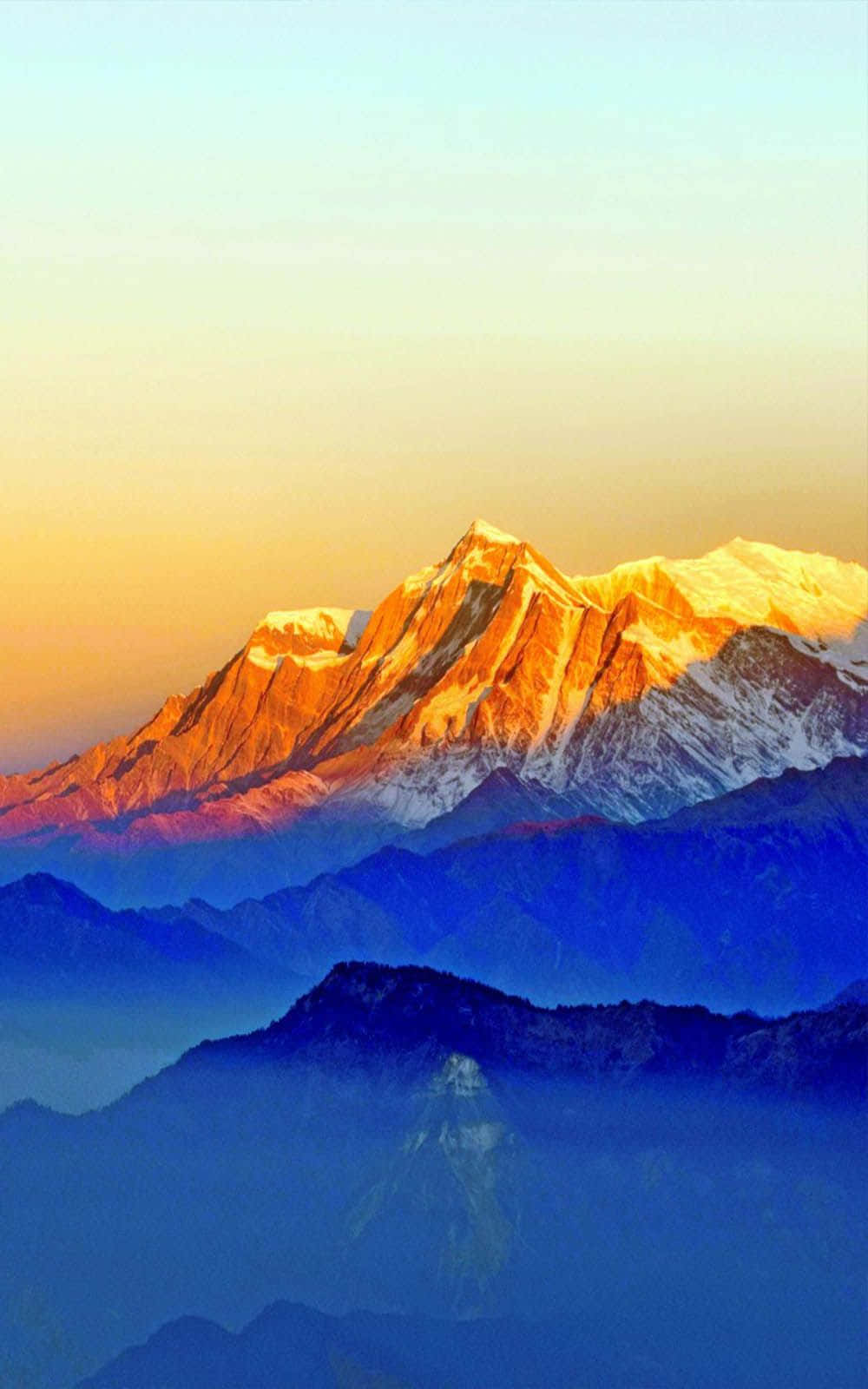 Sunrise_ Glow_on_ Mountain_ Peaks.jpg Wallpaper