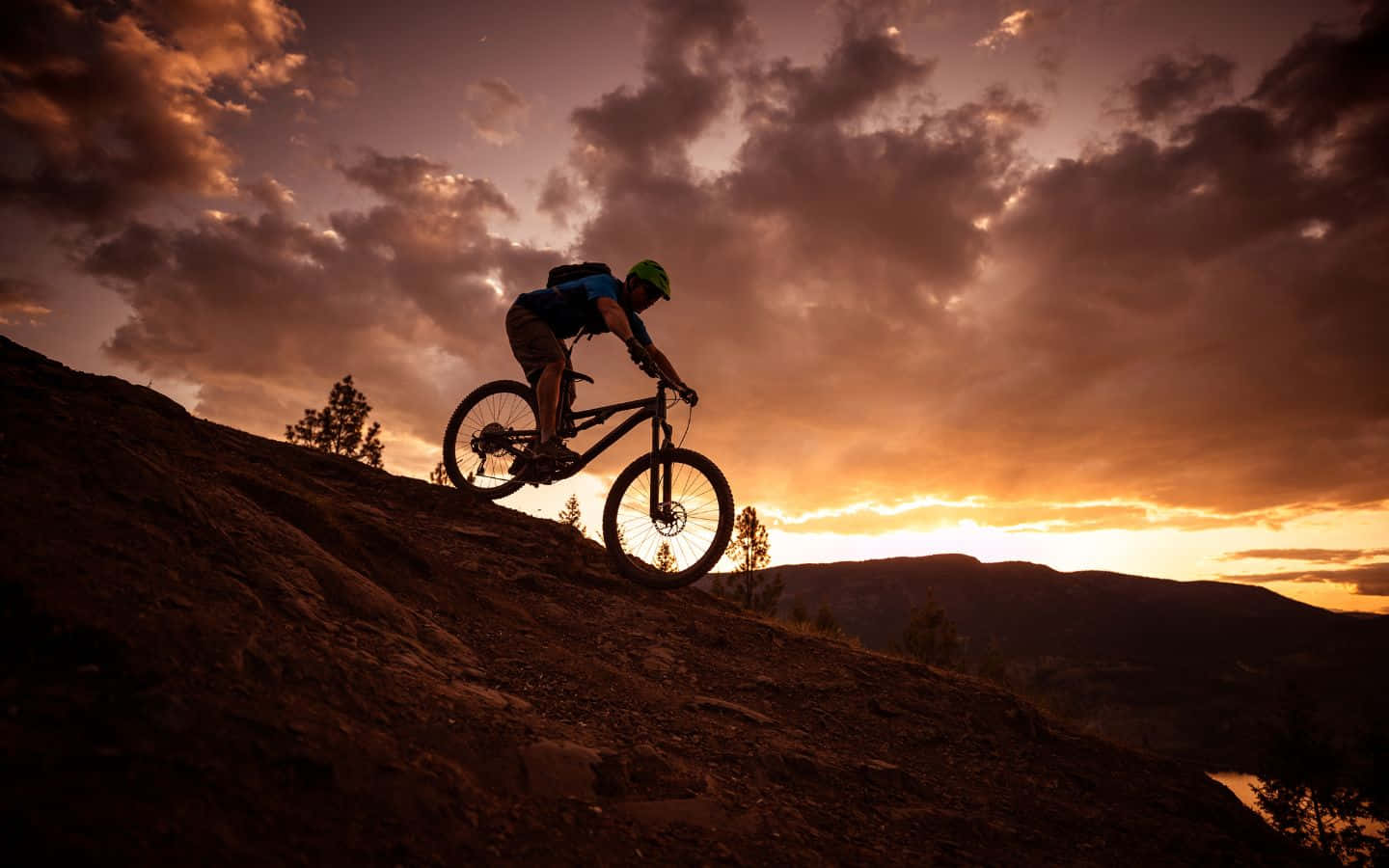 Sunrise Over A Lush Hilltop In The Distance. Wallpaper