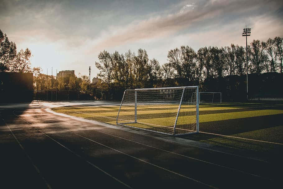 Sunrise Soccer Field Goal Post Wallpaper