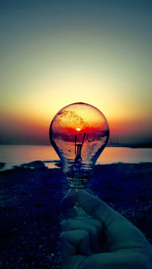 Sunset Behind Incandescent Bulb Wallpaper