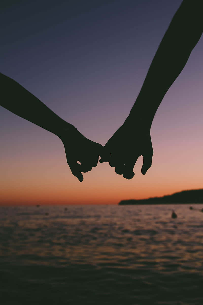 Sunset Couple Hands Wallpaper