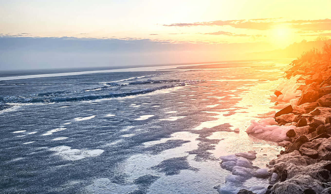 Sunset Over Frozen Lake Wallpaper