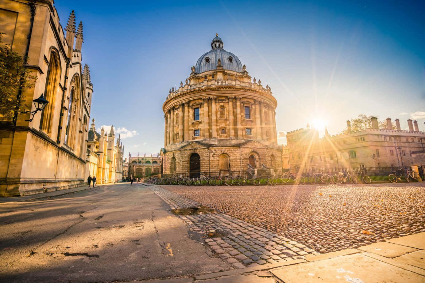 Sunset Over Historic University Building Wallpaper