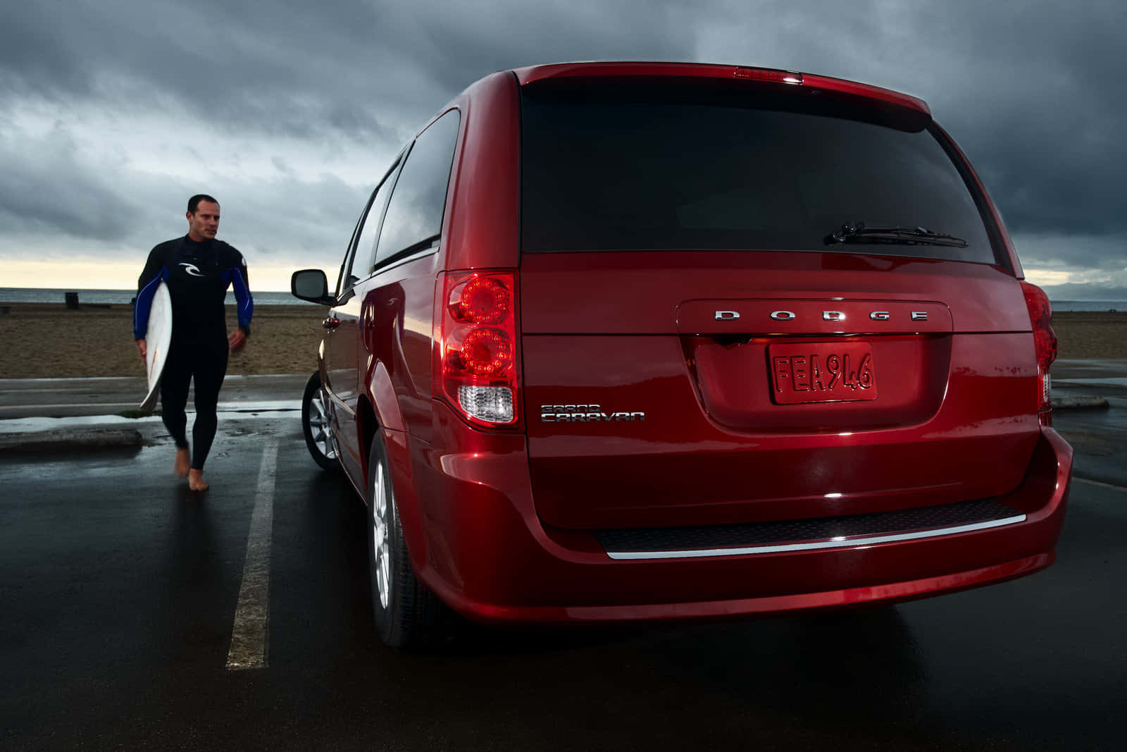 Surfer Approaching Red Dodge Grand Caravan Wallpaper