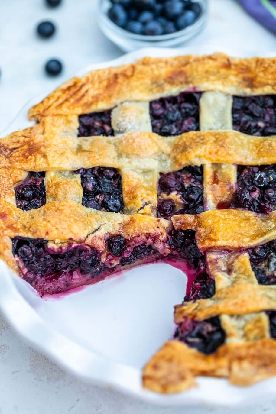 Sweet Blueberry Pie With Fresh, Juicy Blueberries Oozing Out Of A Golden, Flaky Crust. Wallpaper