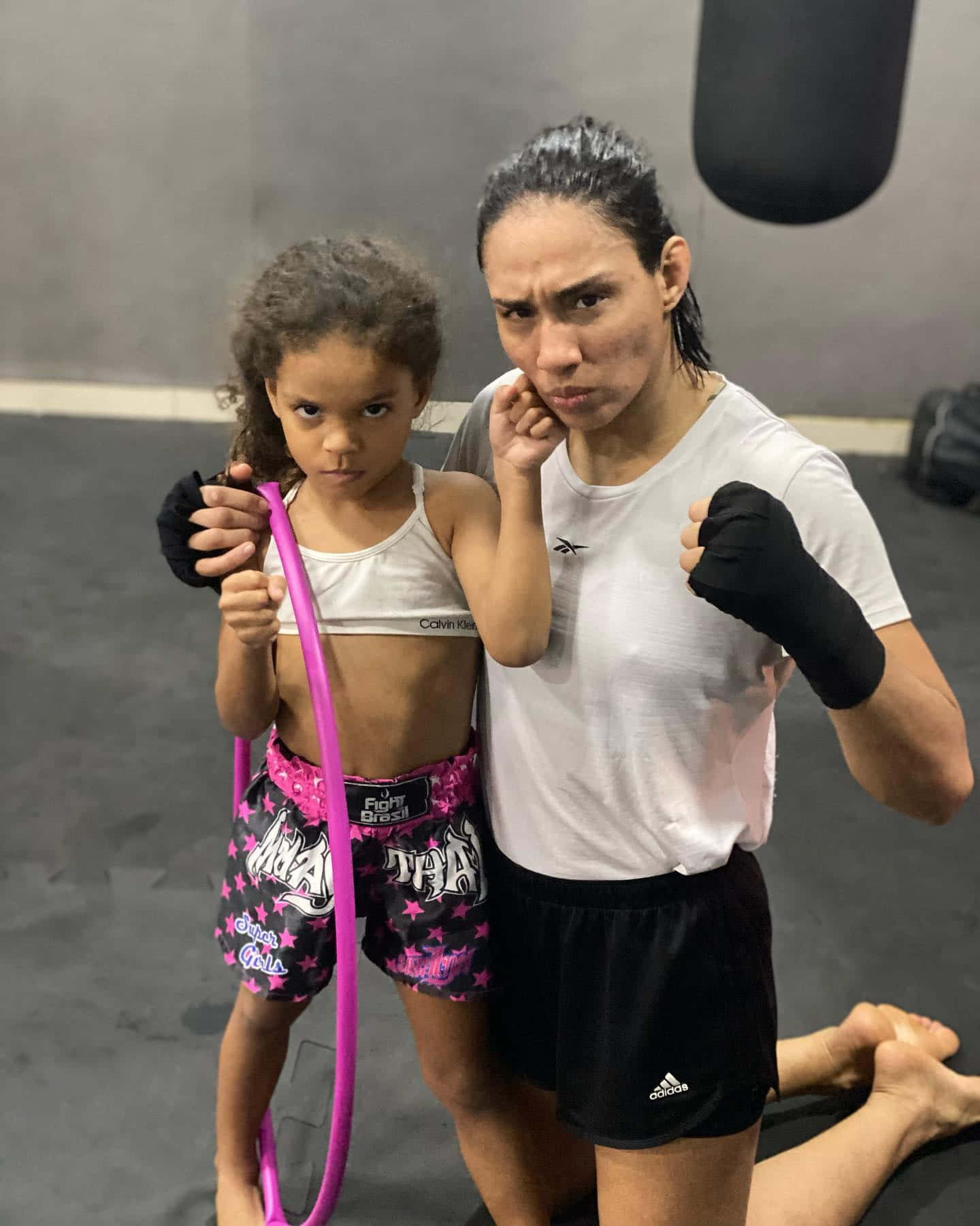 Taila Santos And Daughter At Training Facility Wallpaper