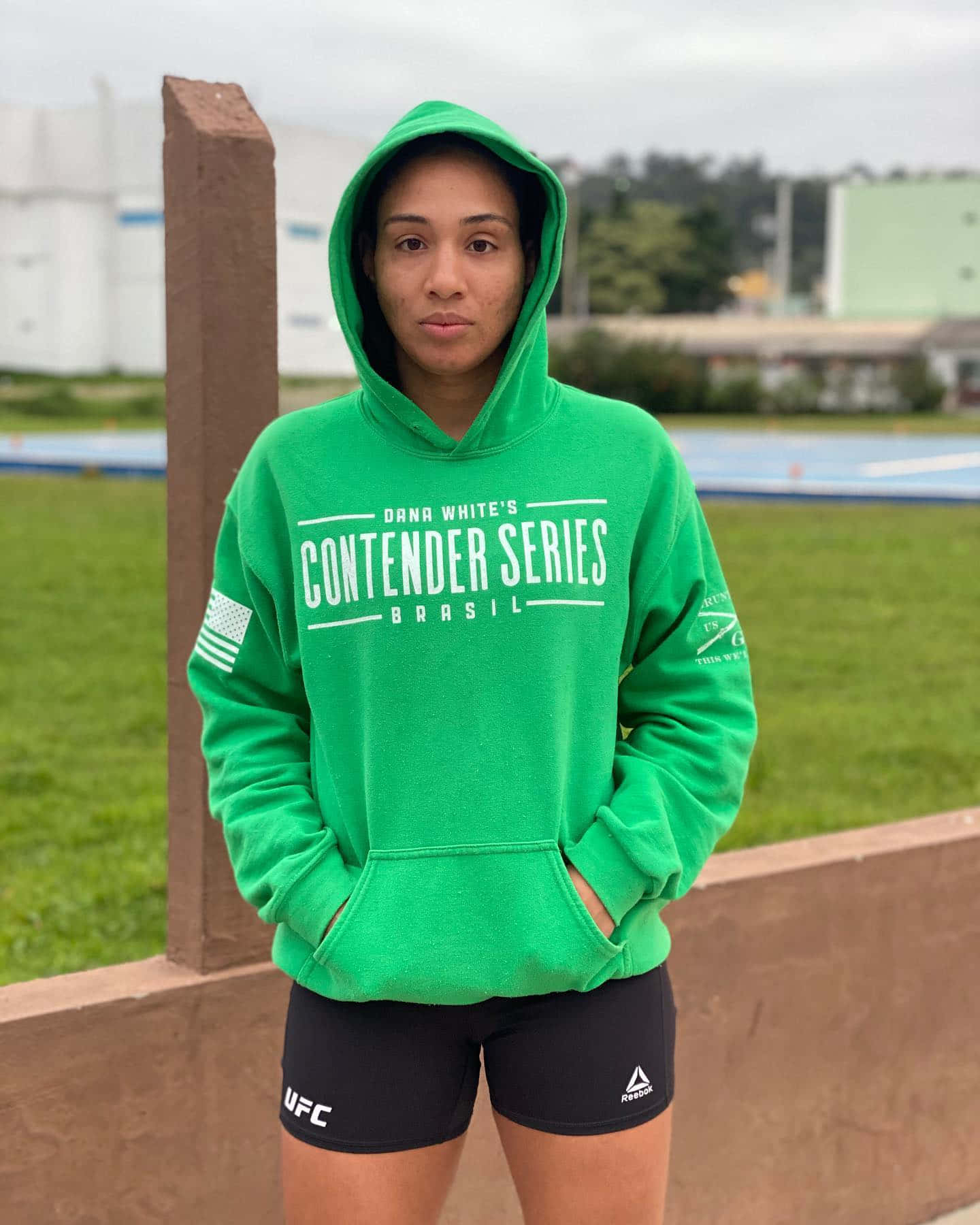 Taila Santos Wearing A Green Hoodie Wallpaper