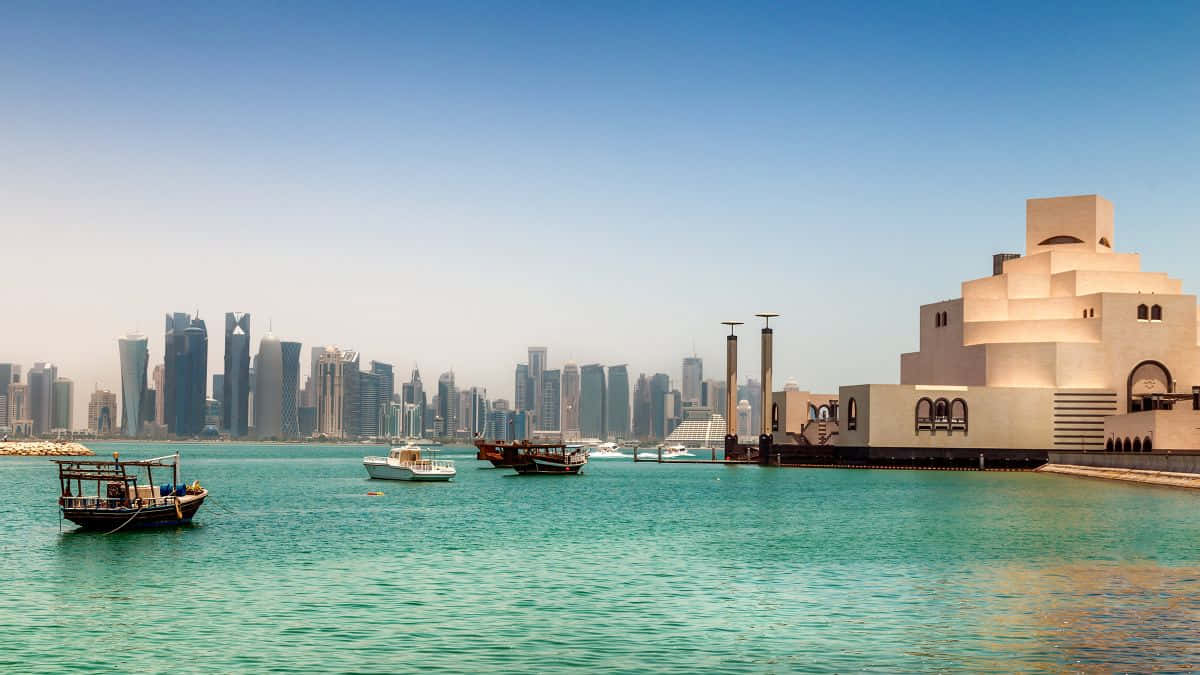 Teal Water Surrounding The Museum Of Islamic Art Wallpaper