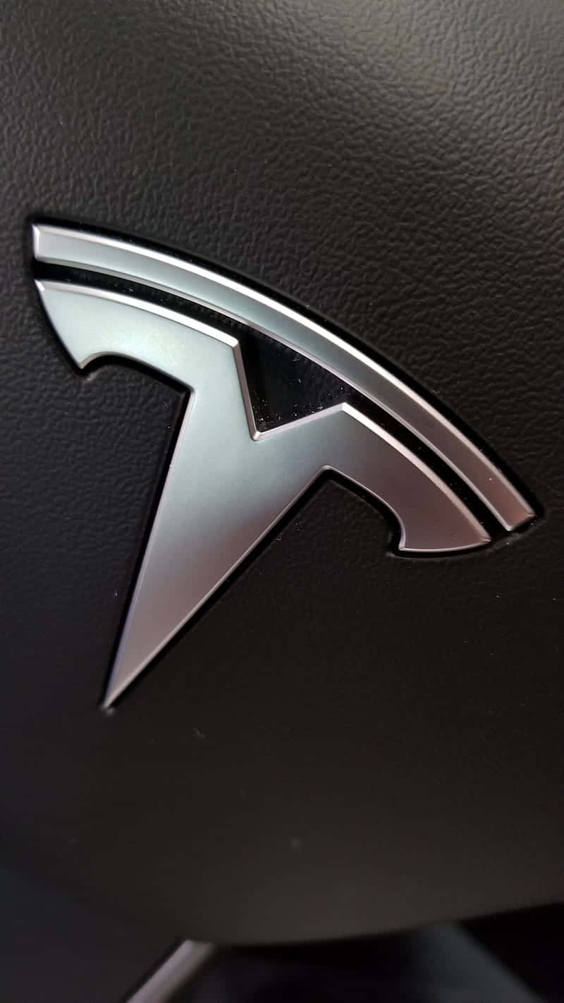 Tesla Logo In Bold White And Red Wallpaper