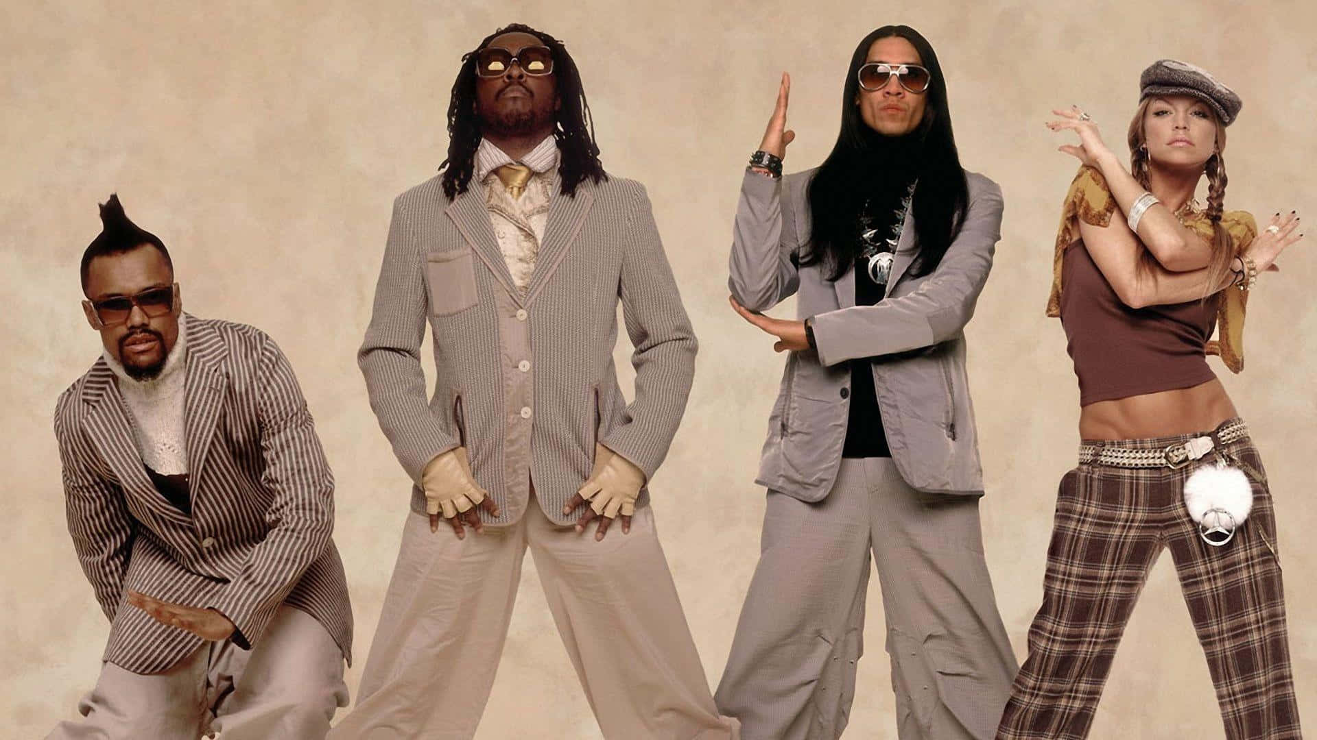 The Black Eyed Peas Bring Their Musical Energy To The Stage Wallpaper