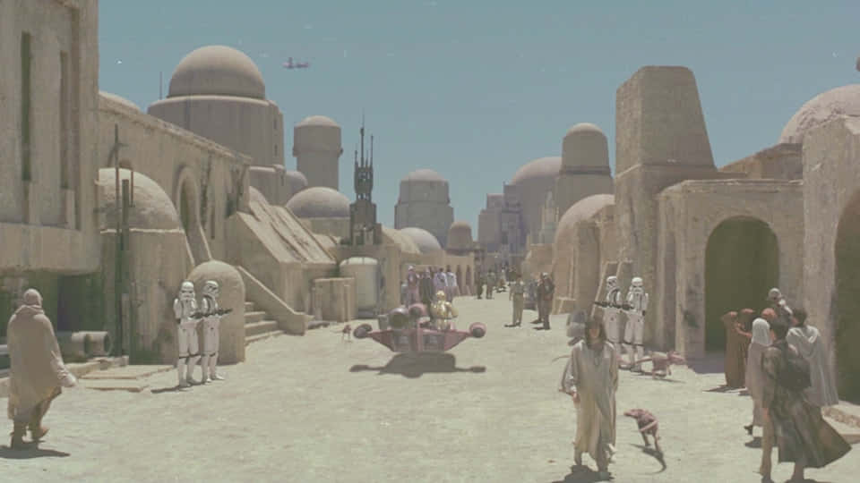 The Bustling Port Of Mos Eisley, Resting On The Planet Tatooine Wallpaper