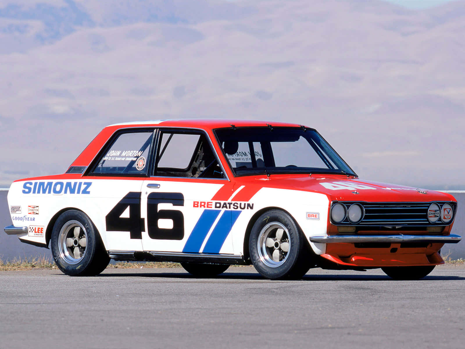 The Classic Datsun 510 Cruising Down The Highway Wallpaper