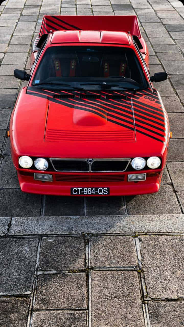 The Elegant Lancia On A Scenic Drive Wallpaper