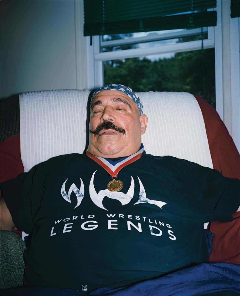 The Iron Sheik Relaxing On Sofa Wallpaper